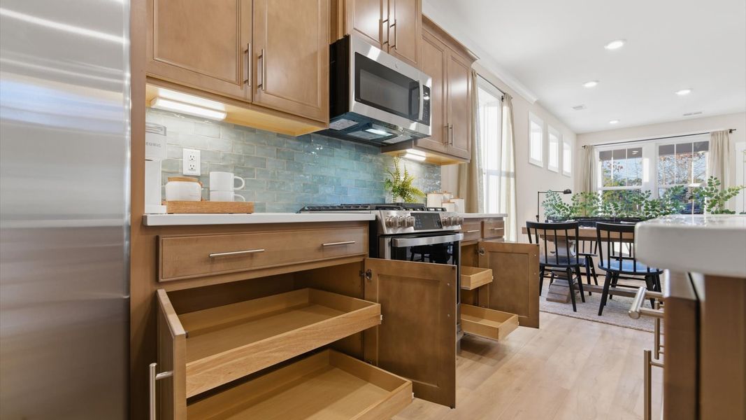 Modern kitchen with plenty of space for prep, storage, and gathering located at Pelham Crossing in Greenville, SC