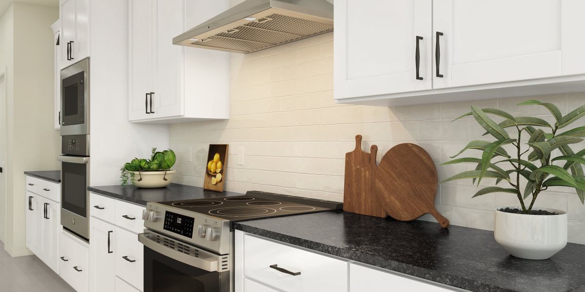 Kitchen with subway tile backsplash and stainless steel appliances