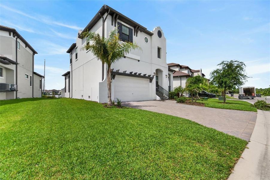 Front exterior of a new home in SouthShore Yacht Club, Ruskin, FL, highlighting curb appeal (Image 26).