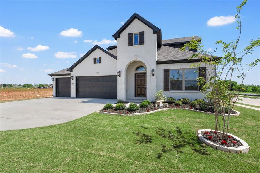 Front exterior of a new home in , Venus, TX, highlighting curb appeal (Image 19).