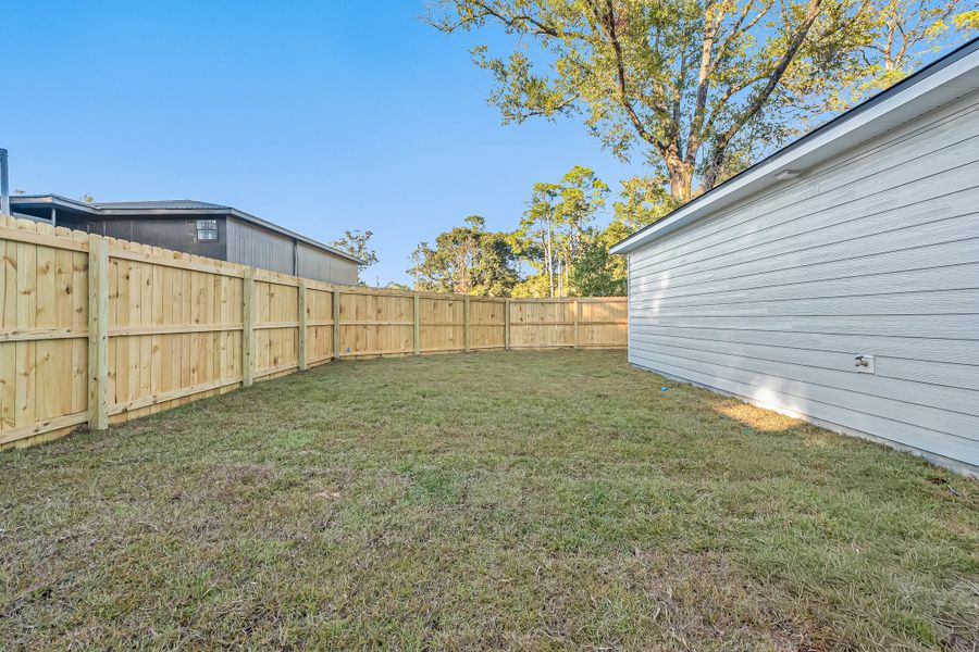 Exterior details and patio area of a home in Live Oak Cottages, Freeport (Image 30). Exterior details and patio area of a home in Live Oak Cottages, Freeport (Image 30).