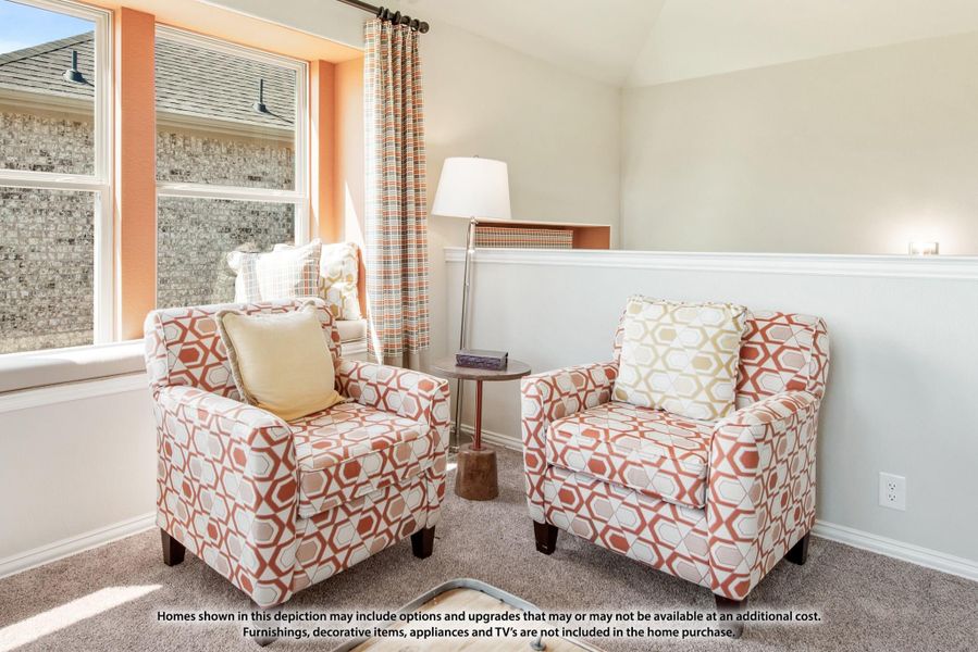 Sitting room with two patterned accent chairs, small side table, and large windows with curtains Sitting room with two patterned accent chairs, small side table, and large windows with curtains