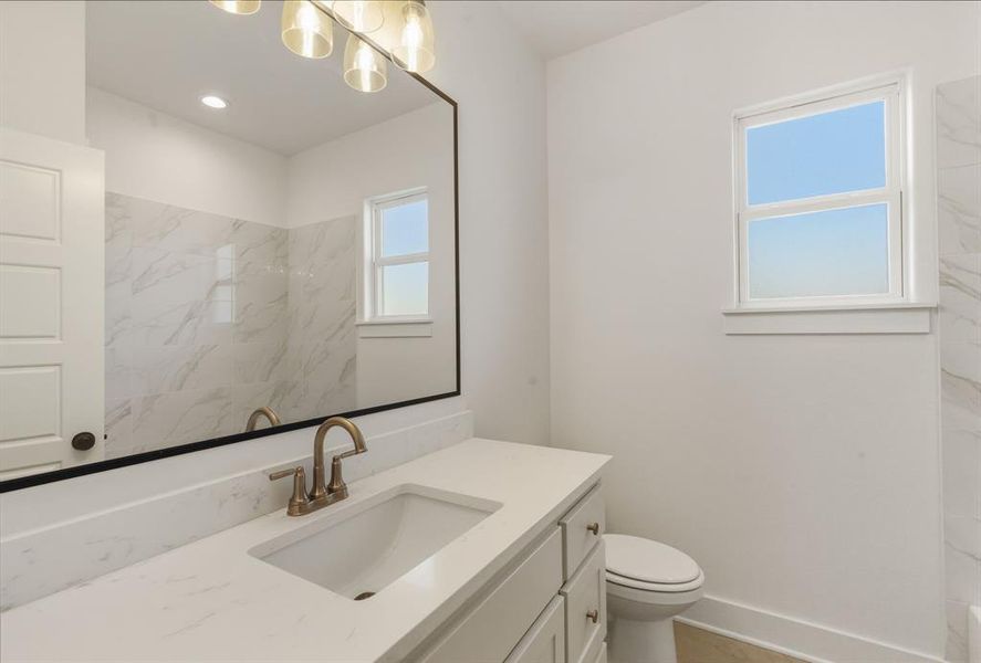 Full bath with vanity and toilet