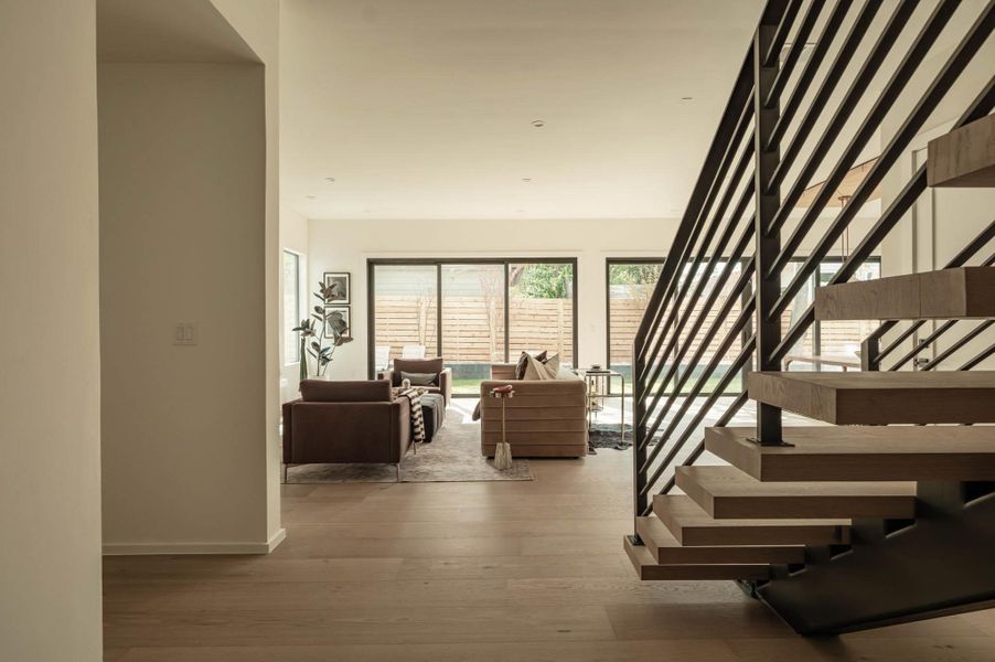 Stairway featuring wood floating stairs