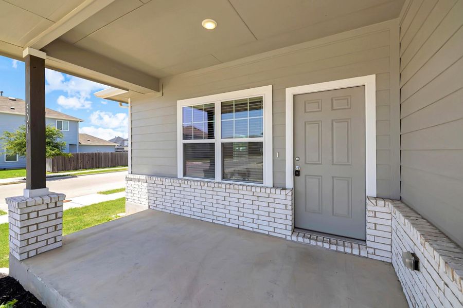 Property entrance featuring a porch Property entrance featuring a porch