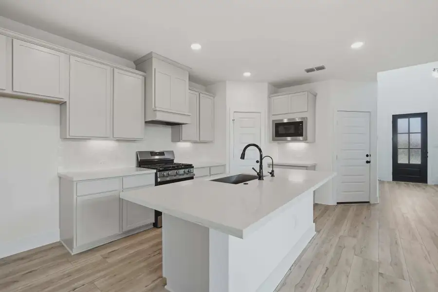 Representative furnished interior of a home built from the Sage by Chesmar Homes in Stillwater Ranch, Buda (Image 3).