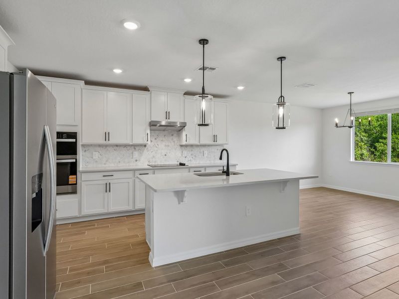 Furnished interior view inside a new home in The Grove at Stuart Crossing - Signature Series, Bartow (Image 4).