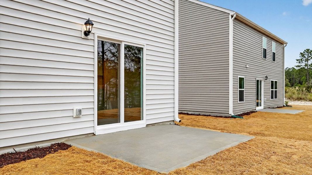 Exterior details and patio area of a home in Mangum Farms, Stem (Image 3).