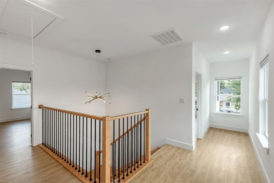 Corridor featuring light hardwood / wood-style flooring