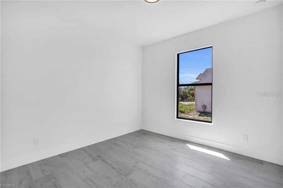 Spacious, unfurnished interior of a new home in , Port Charlotte (Image 20).