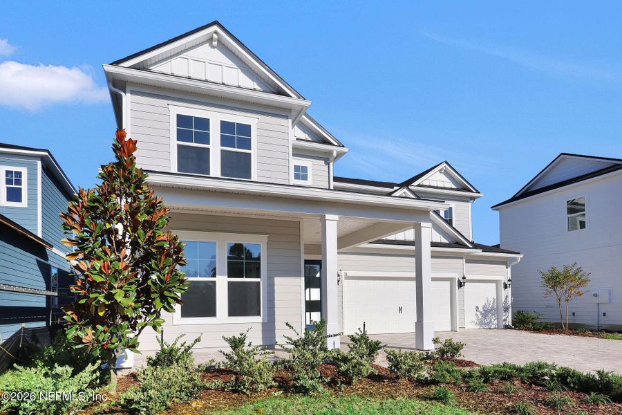 Front exterior of a new home in The Landings at Saint Johns, St. Johns, FL, highlighting curb appeal (Image 26).