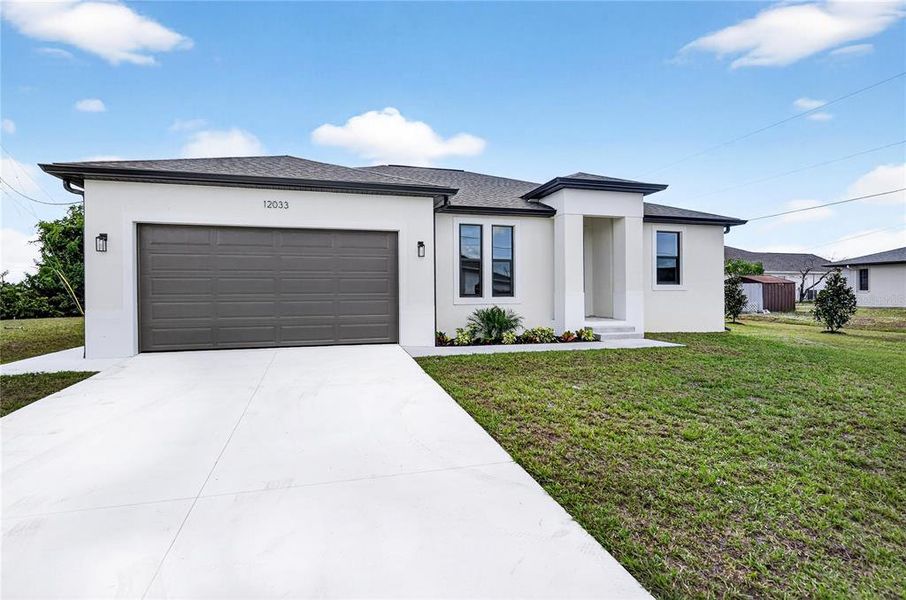 Front exterior of a new home in , North Port, FL, highlighting curb appeal (Image 22).
