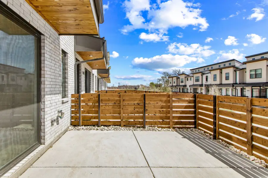 Exterior details and patio area of a home in Willow Grove Townhomes, Melissa (Image 28).