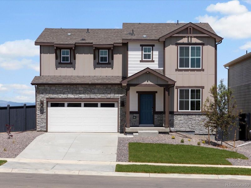 Front exterior of a new home in Westgate, Greeley, CO, highlighting curb appeal (Image 21).