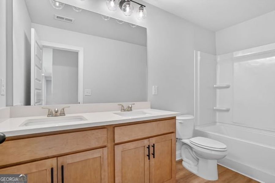 Furnished interior view inside a new home in Stone Brooke, Gray (Image 11).
