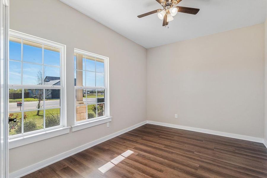 Front office featuring ceiling fan and dark wood-type flooring Front office featuring ceiling fan and dark wood-type flooring