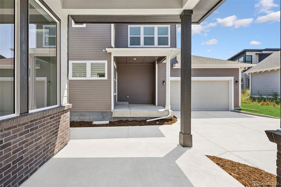 Exterior details and patio area of a home in Painted Prairie Cottage, Aurora (Image 3).