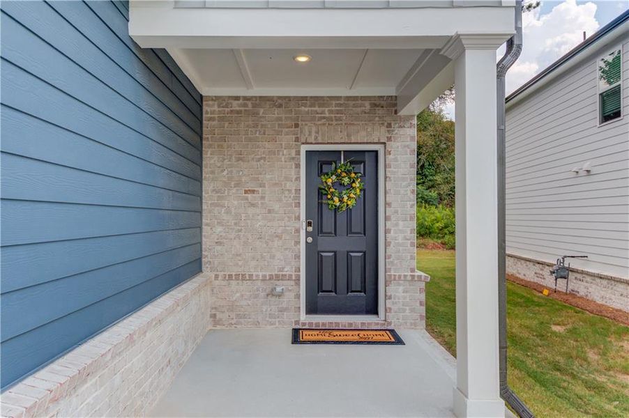 Front exterior of a new home in Sweetwater Green - Royal Series, Lawrenceville, GA, highlighting curb appeal (Image 24).