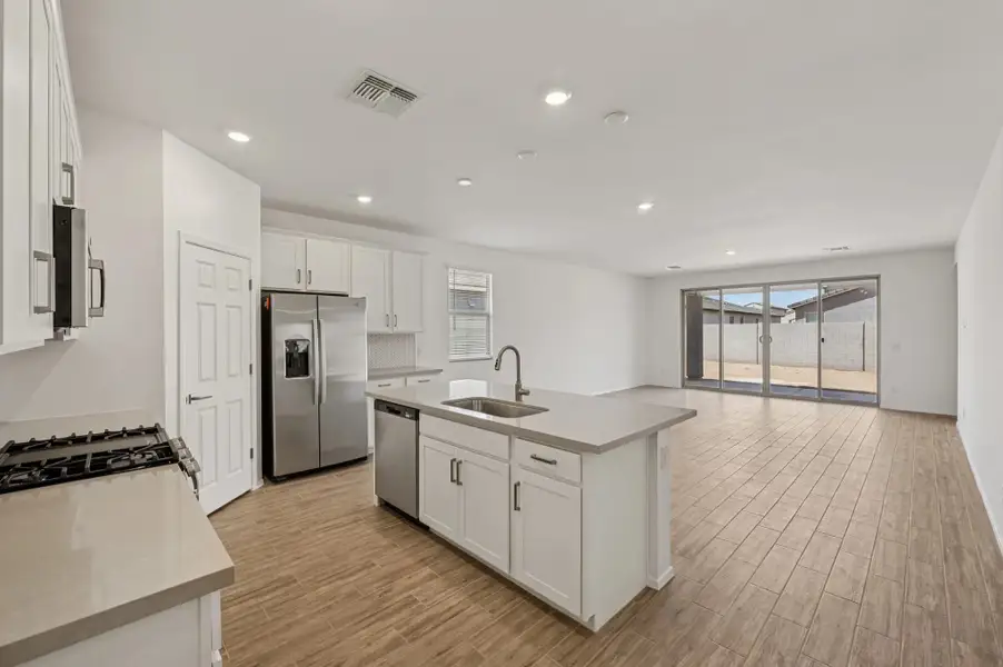 Kitchen, dining and great room. Not actual home, finishes may vary by community.