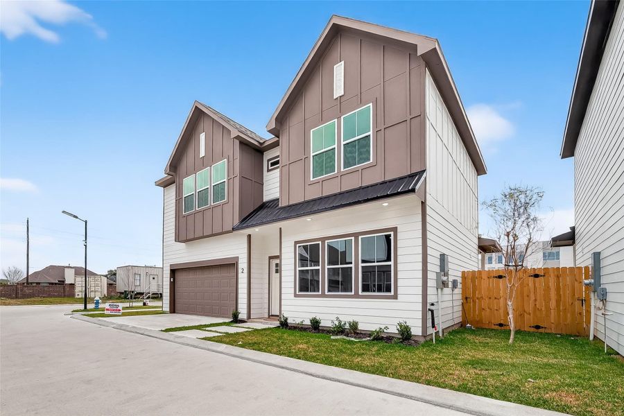 Front exterior of a new home in Metro Village, Houston, TX, highlighting curb appeal (Image 23).
