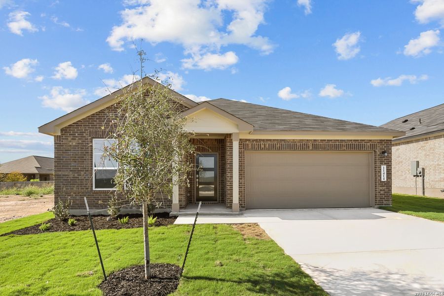 Front exterior of a new home in Bricewood, San Antonio, TX, highlighting curb appeal (Image 25).