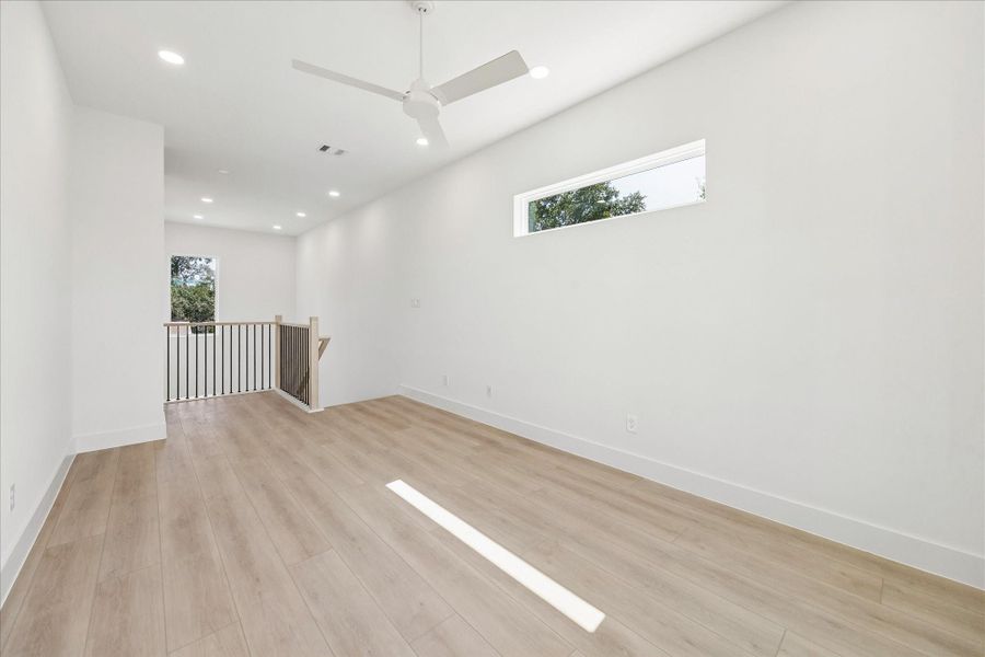 A versatile loft offers endless flexibility as a media room, playroom, home office, or second living area.