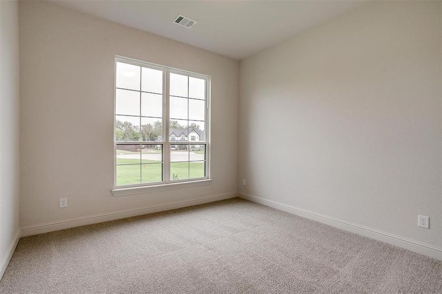 Unfurnished room with carpet floors