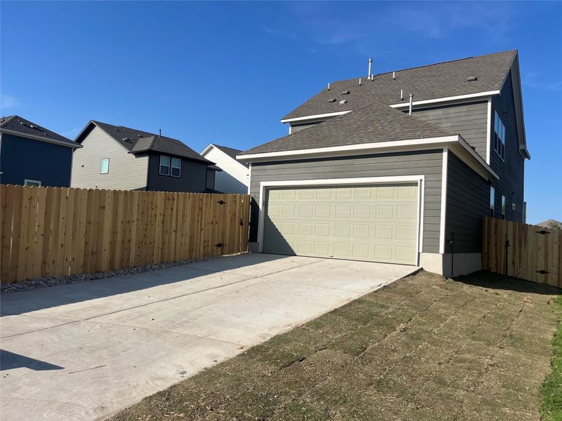 Exterior details and patio area of a home in The Cottages at Lariat, Liberty Hill (Image 24).