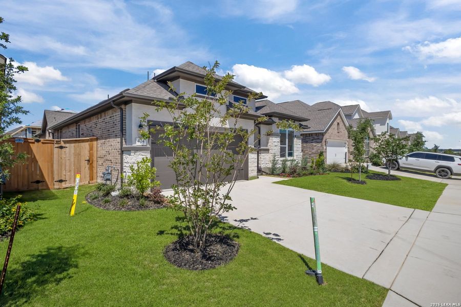 Front exterior of a new home in Mayfair, New Braunfels, TX, highlighting curb appeal (Image 25).