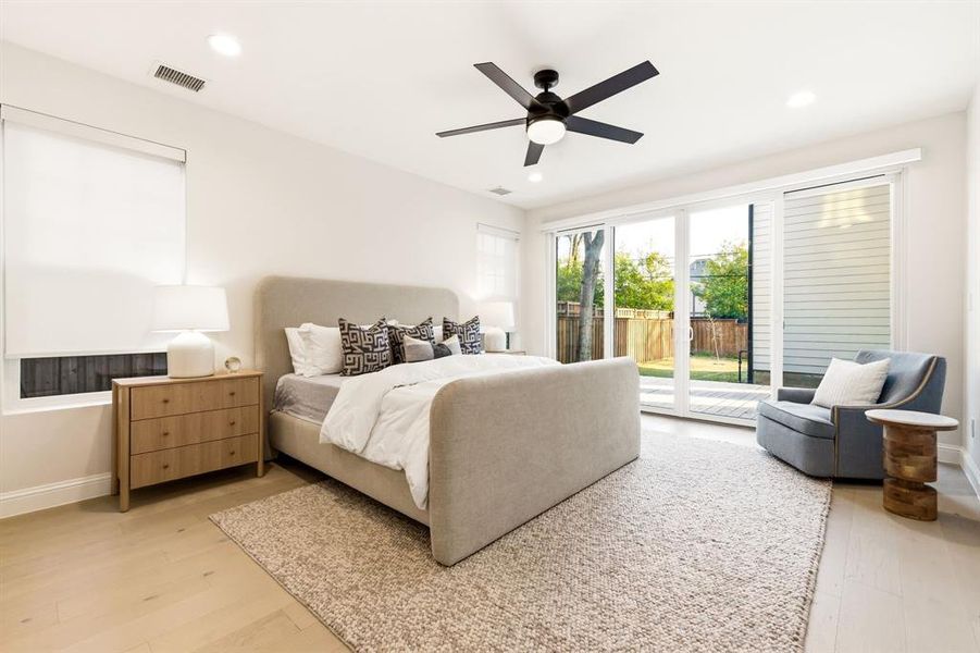Bedroom with access to exterior, light wood-style flooring, a ceiling fan, and recessed lighting