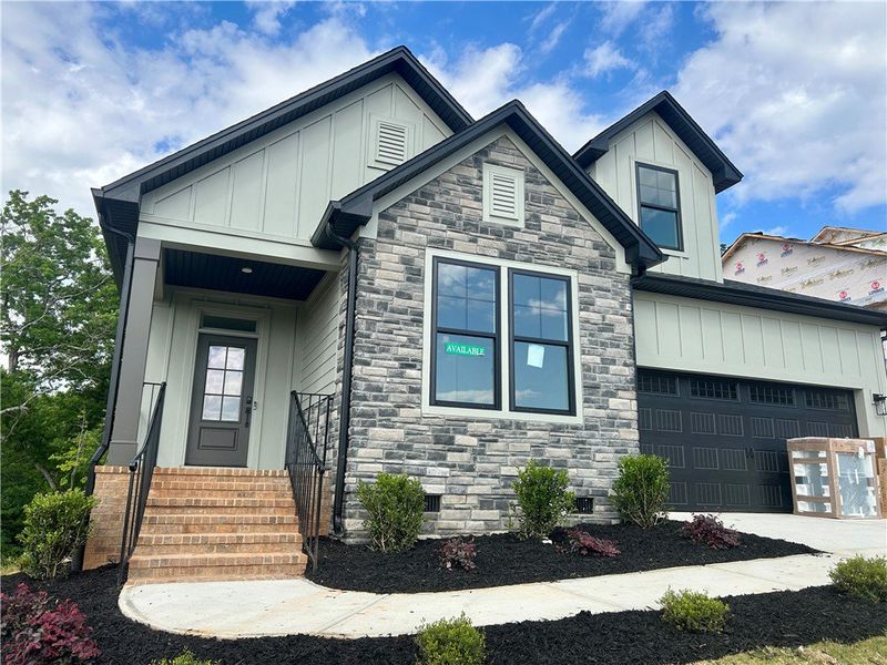 This newly constructed home features a charming ex This newly constructed home features a charming ex