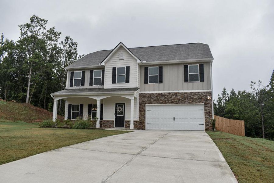 Front exterior of a new home in , Dallas, GA, highlighting curb appeal (Image 29). Front exterior of a new home in , Dallas, GA, highlighting curb appeal (Image 29).