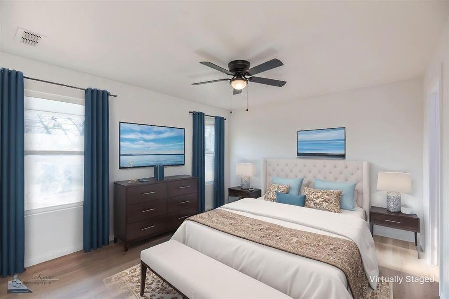 Bedroom featuring wood finished floors and ceiling fan