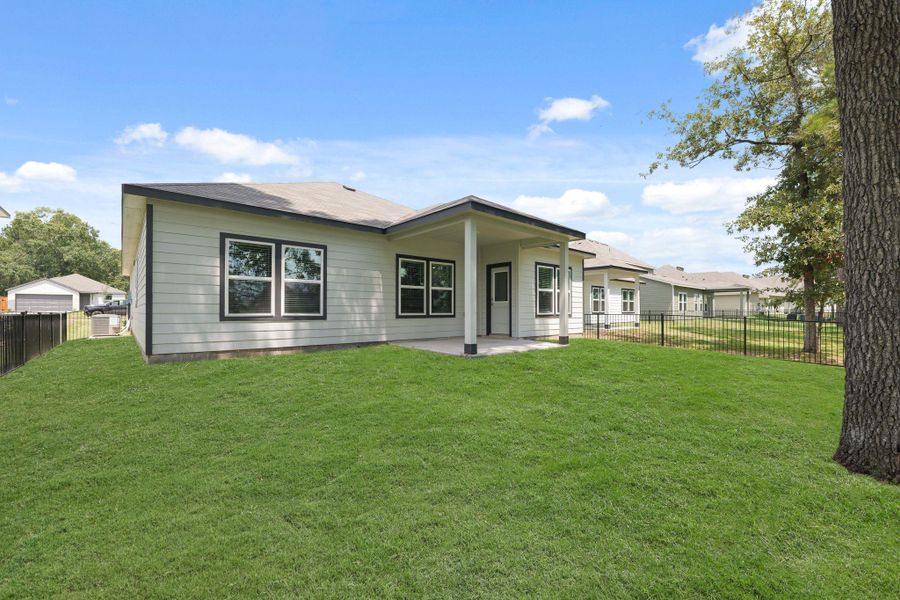Front exterior of a new home in Lakes at Crockett Martin, Conroe, TX, highlighting curb appeal (Image 2).