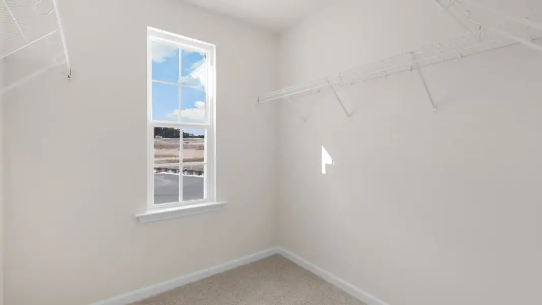 Spacious, unfurnished interior of a new home in The Townes at Galvins Ridge, Sanford (Image 25).