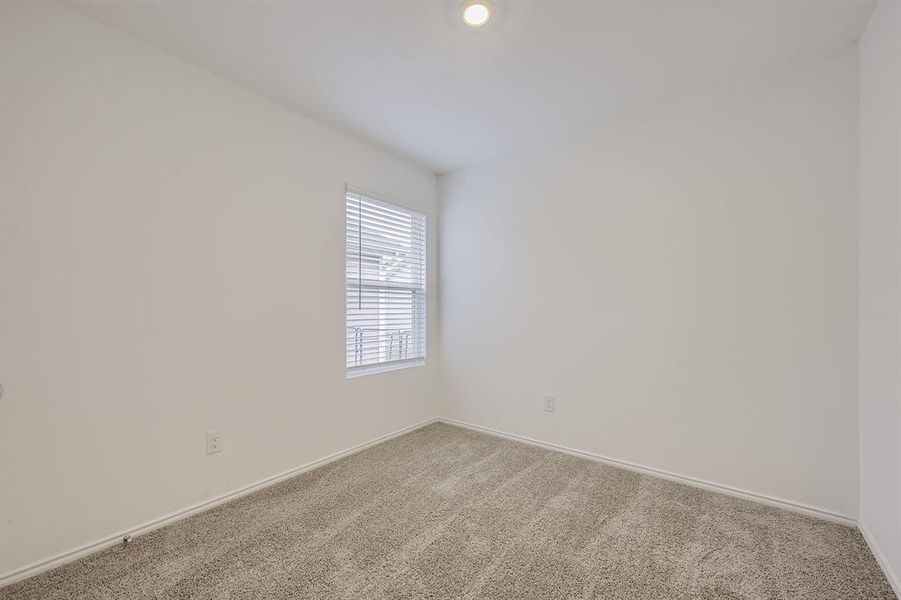 Carpeted secondary bedroom