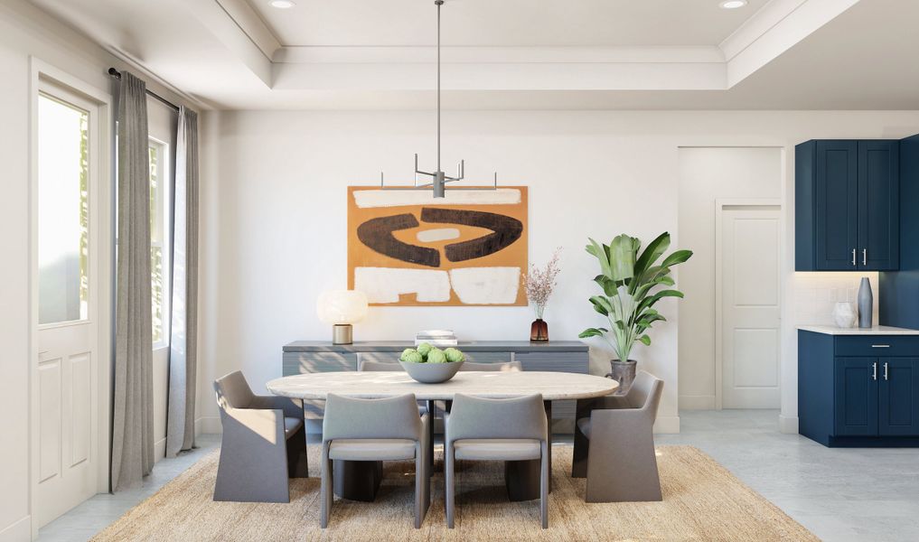 Dining area with crown moulding and tray ceiling