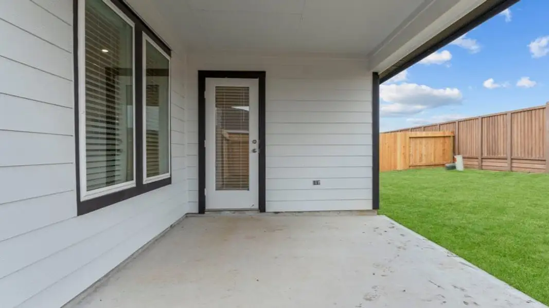 Exterior details and patio area of a home in Tamarron, Fulshear (Image 3).