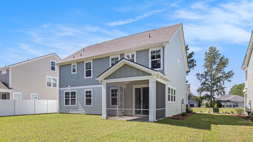 Exterior details and patio area of a home in Brunswick Plantation, Ash (Image 3).