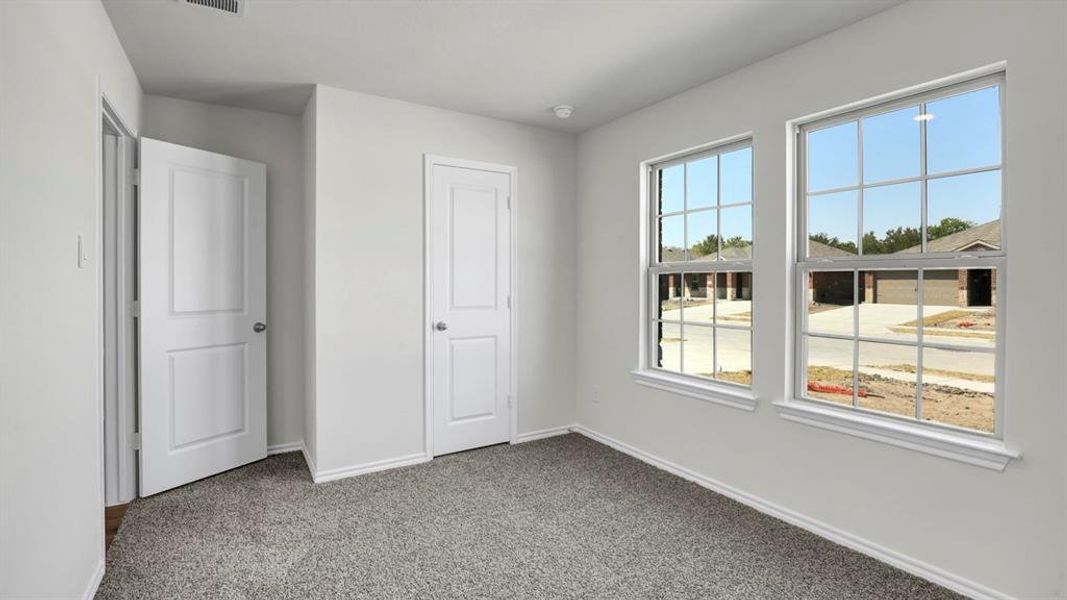 Unfurnished bedroom with carpet floors and a closet