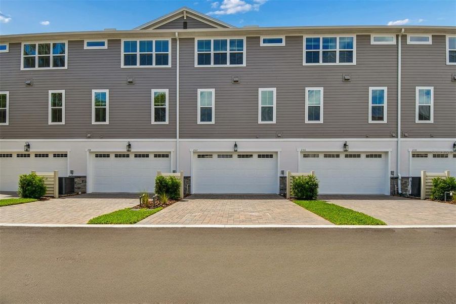 Front exterior of a new home in Townes at Northlake, Oviedo, FL, highlighting curb appeal (Image 1). Front exterior of a new home in Townes at Northlake, Oviedo, FL, highlighting curb appeal (Image 1).