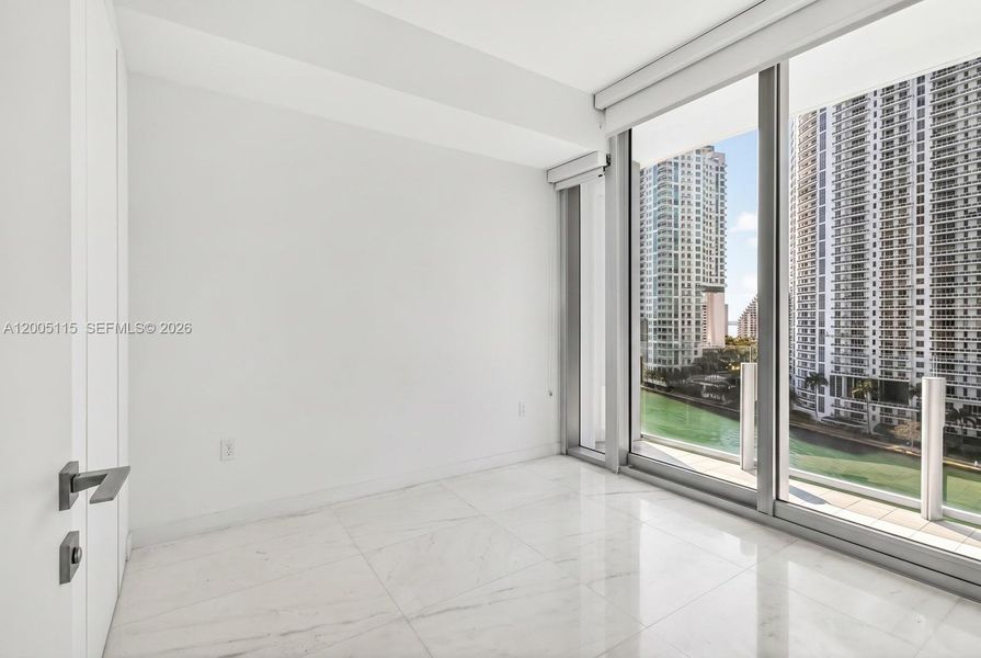 Spacious, unfurnished interior of a new home in Aston Martin Residences, Miami (Image 9).