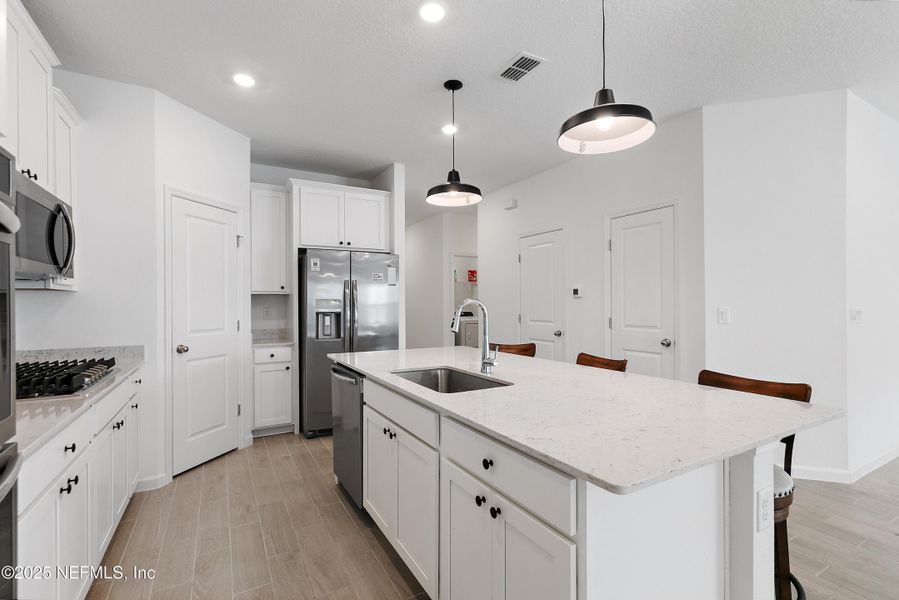 Furnished interior view inside a new home in Tributary: Lakeview at Tributary 50's, Yulee (Image 8).