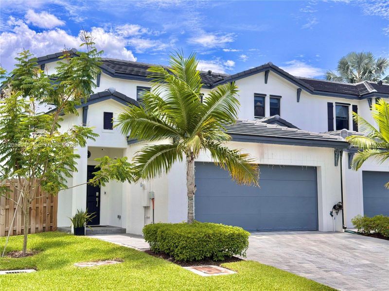 Front exterior of a new home in , Dania Beach, FL, highlighting curb appeal (Image 23).