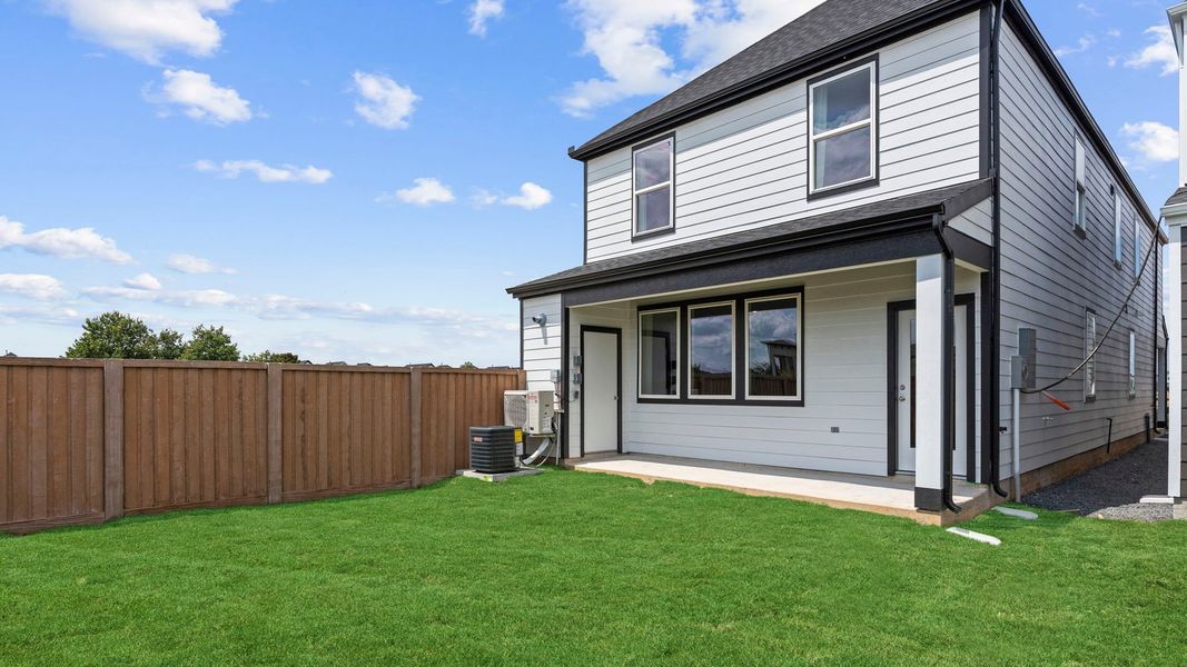 Exterior details and patio area of a home in Villarosa at Tamarron, Katy (Image 3).