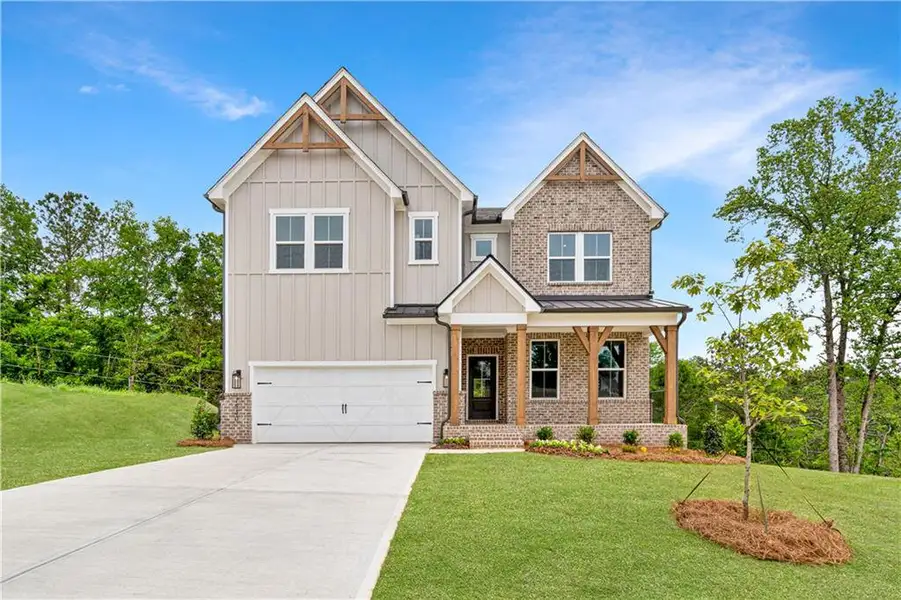 Front exterior of a new home in The Paddocks at Doc Hughes, Buford, GA, highlighting curb appeal (Image 1). Front exterior of a new home in The Paddocks at Doc Hughes, Buford, GA, highlighting curb appeal (Image 1).