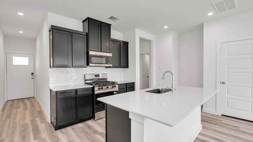 Representative furnished interior of a home built from the Hibiscus by D.R. Horton in City Gate North, Houston (Image 3).