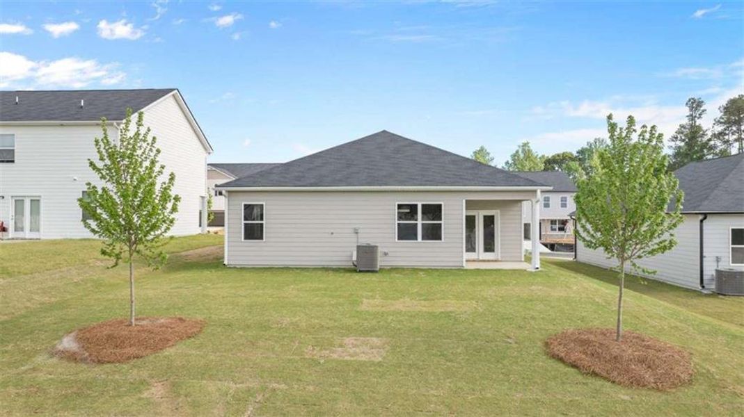 Exterior details and patio area of a home in Champion's Run, Lithonia (Image 3).