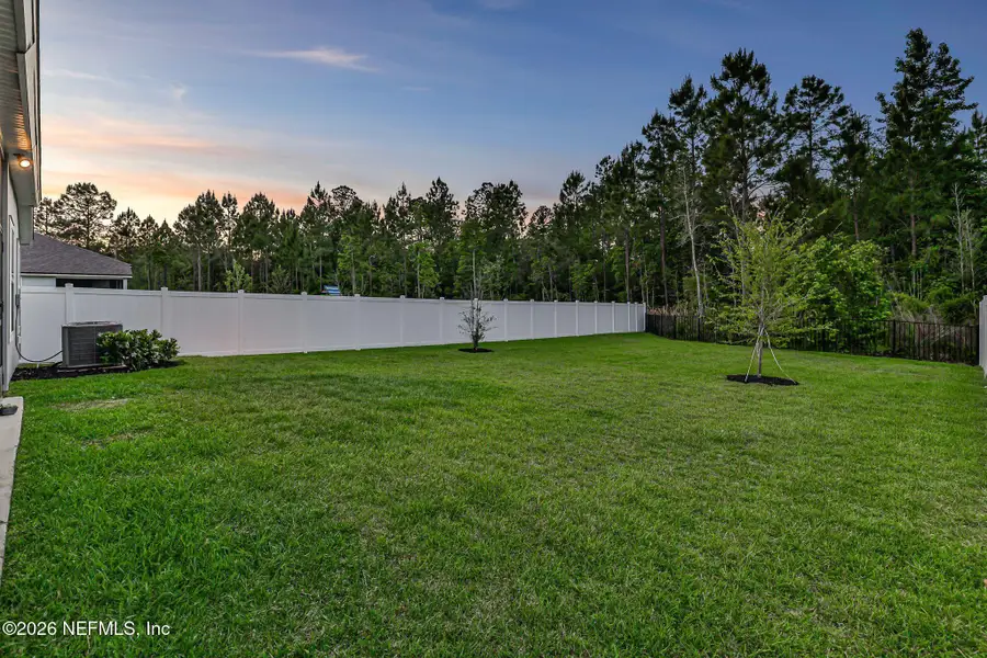 Exterior details and patio area of a home in Cross Creek, Green Cove Springs (Image 4).