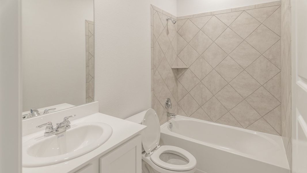 Representative furnished interior of a home built from the Medbourne by D.R. Horton in Woodcreek, Fate (Image 6).